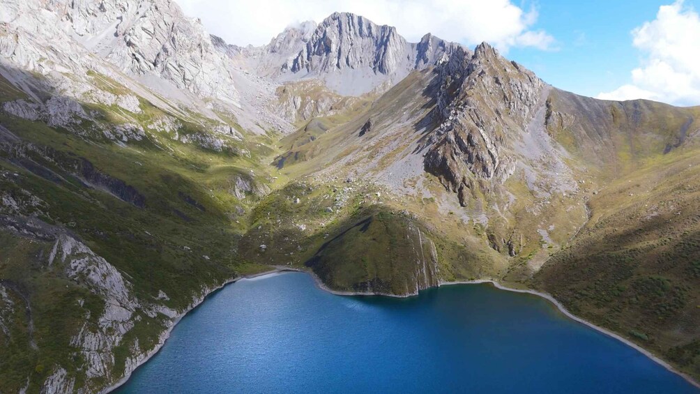 A mountainous landscape with a lake surrounded by rocky terrain. 1
