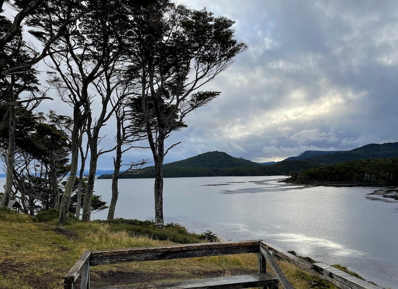 A lake surrounded by trees and hills. 4