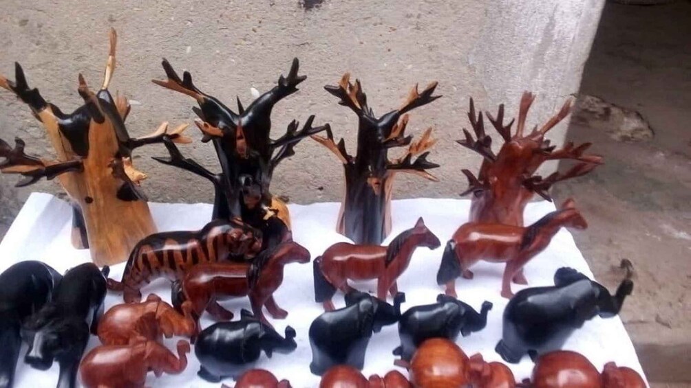 A collection of wooden animal carvings. 5