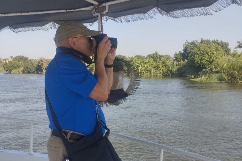 A person taking a photograph with a camera. 5