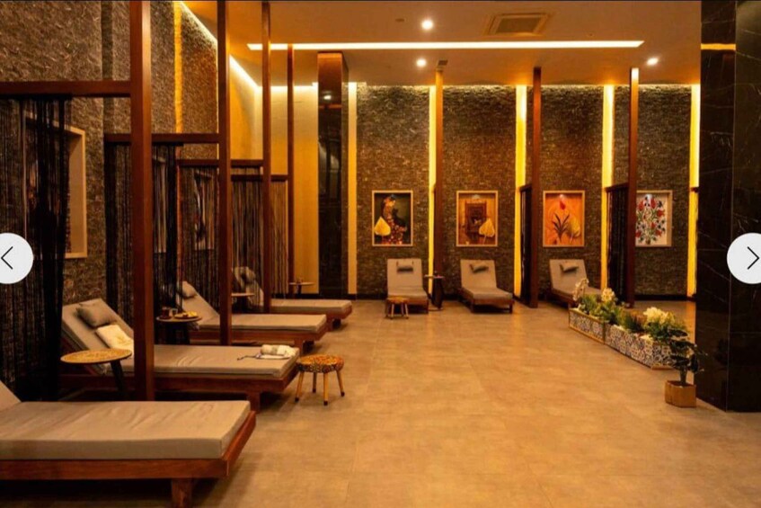 A spa with lounge chairs, wooden panels, and framed artwork on the walls. 1