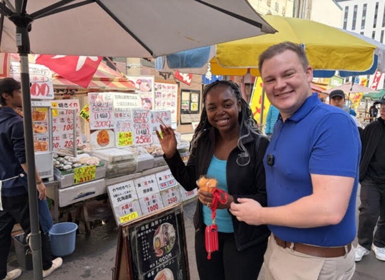 A street food stall with various food items and price signs. 2