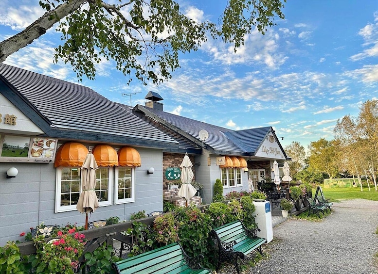A farm cafe with outdoor seating and a garden. 2