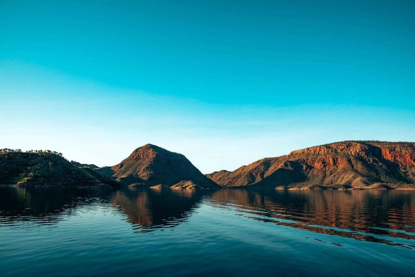 A calm lake with mountains in the background. 4