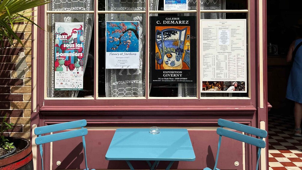 A cafe with posters advertising art exhibitions and a menu. 5