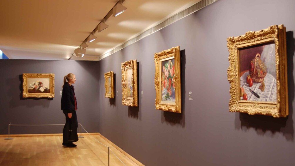 An art gallery with paintings on display. 3