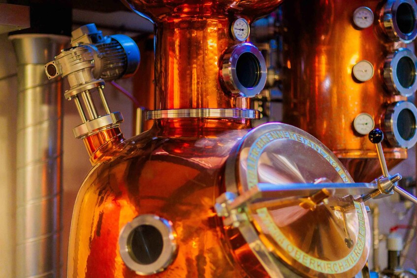 A copper distillation apparatus with gauges and a pressure gauge. 5
