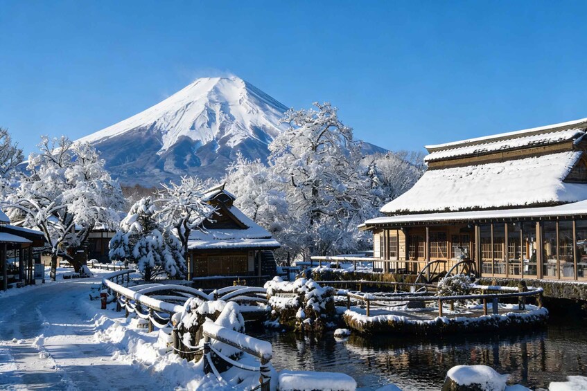 A snow-covered landscape with a traditional Japanese building, a pond with a wooden bridge, and a snow-capped mountain in the background. 3
