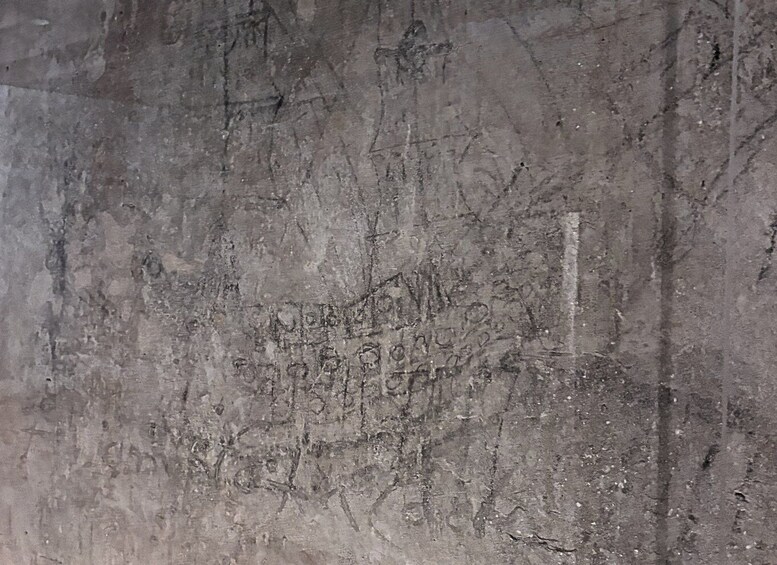 A textured surface with faint, indistinct markings. 3