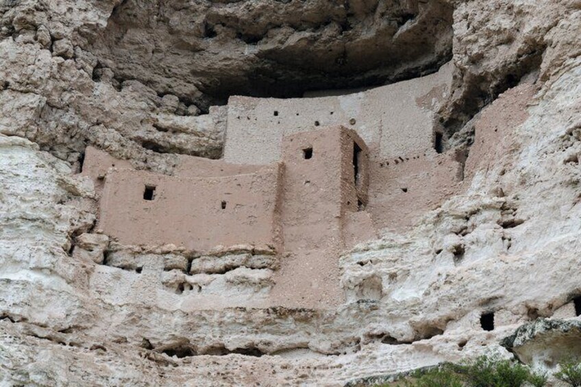 Ancient cliff dwellings with multiple levels and small openings. 2