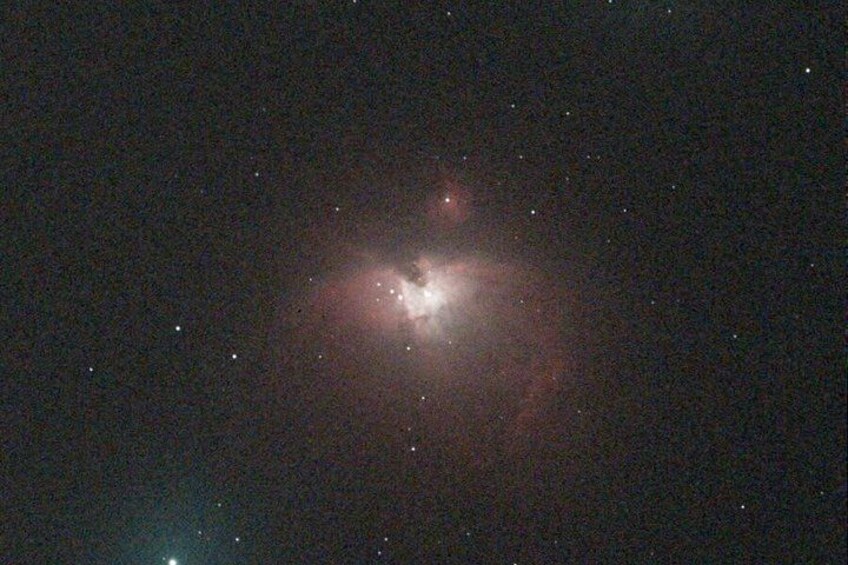 A bright celestial object with surrounding stars. 3