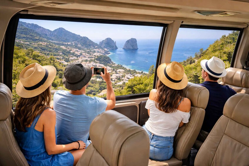 A group of people on a vehicle, enjoying a scenic coastal view with mountains and the sea. 3