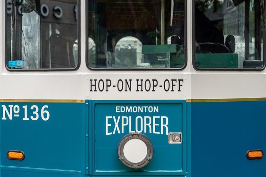 A bus with the text 'HOP-ON HOP-OFF' and 'EDMONTON EXPLORER' on its side. 2