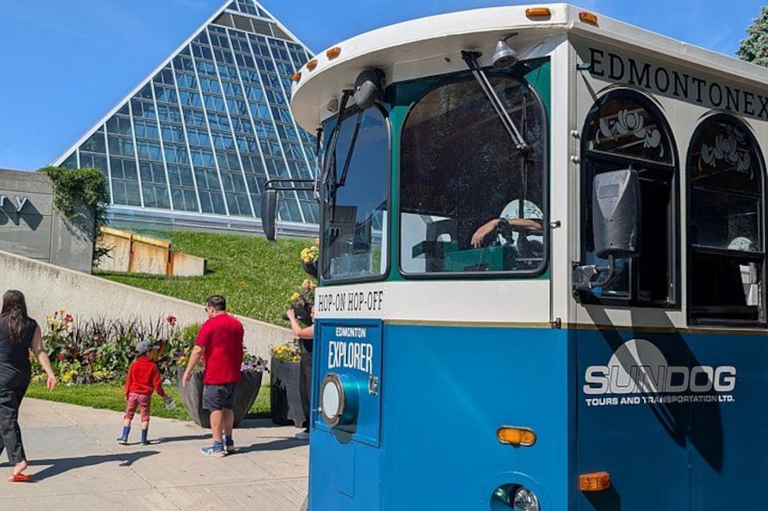 A blue bus with 'EDMONTON EXPLORER' and 'TOURS AND TRANSPORT LTD.' written on it. 3