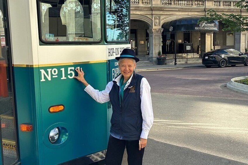A bus with the number 15, a person in uniform, and a building with a sign that reads 'Hotel Macdonald.' 3