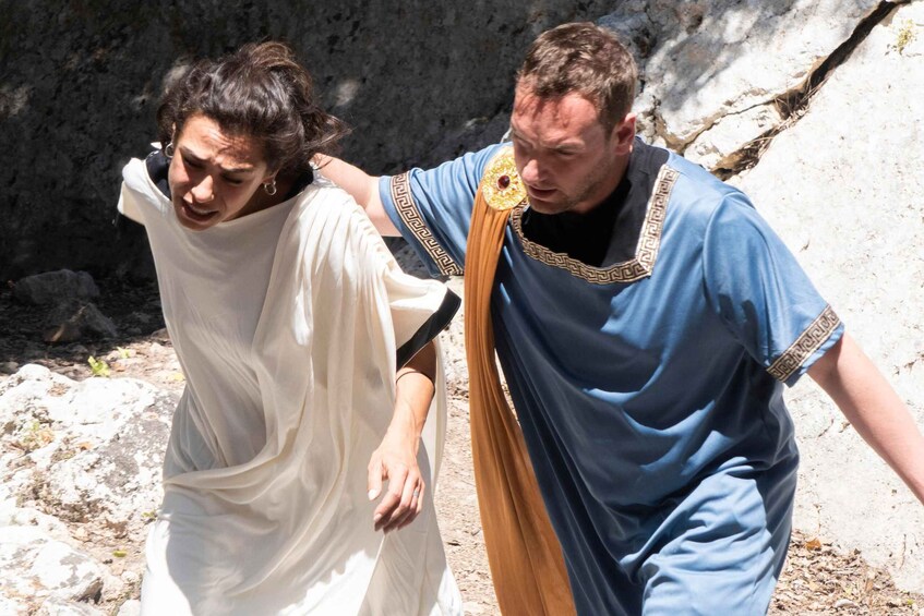 Two people walking on a rocky path. 4