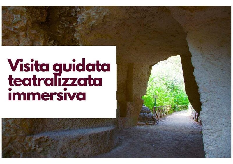A cave passage with a sign indicating a guided tour. 1