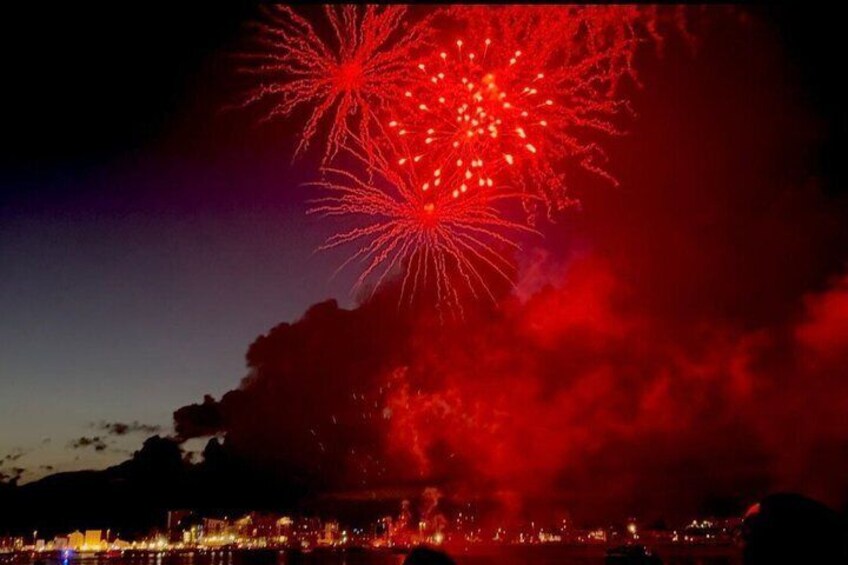 Fireworks over a city skyline at night. 1