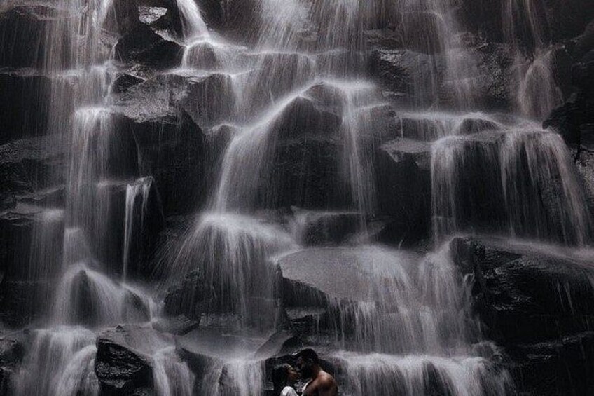 A waterfall cascading over rocks. 2