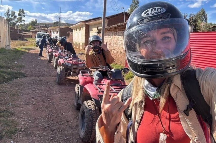 A group of people on ATVs on a dirt path. 1