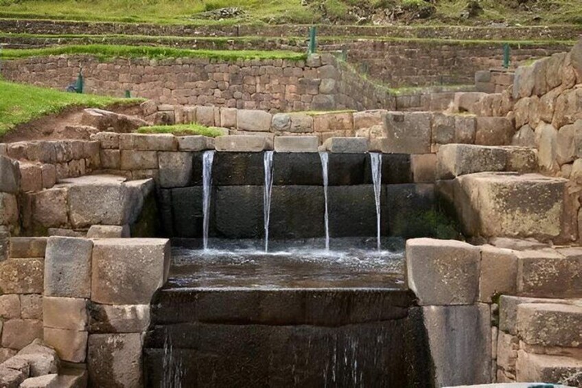 A stone water feature with multiple cascades. 2