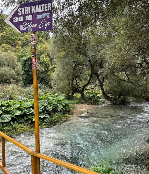 A river with a sign indicating 'SYRI KALTER 30 M Blue Eye.' 5