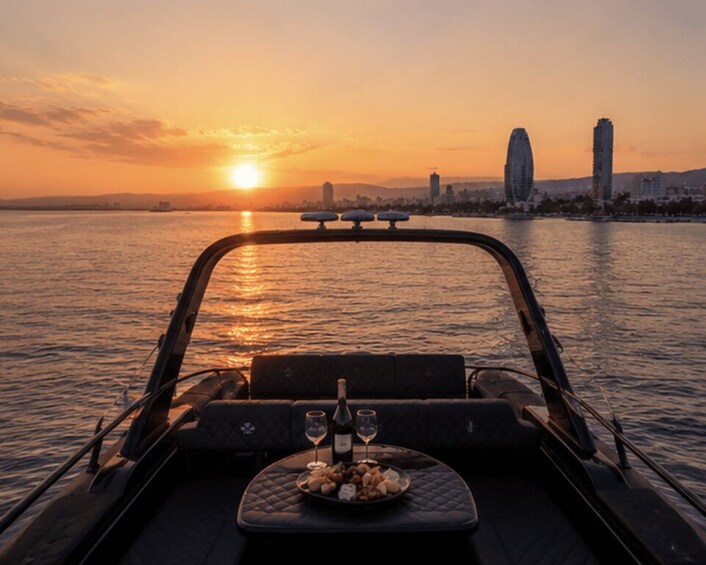 A sunset over a body of water with a city skyline in the background. 3
