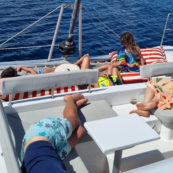 People relaxing on a boat with a view of the ocean. 4