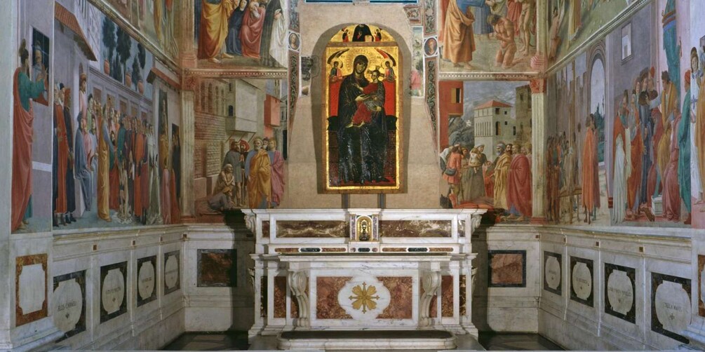 A church interior with frescoes, a central altar, and a statue of a religious figure. 2