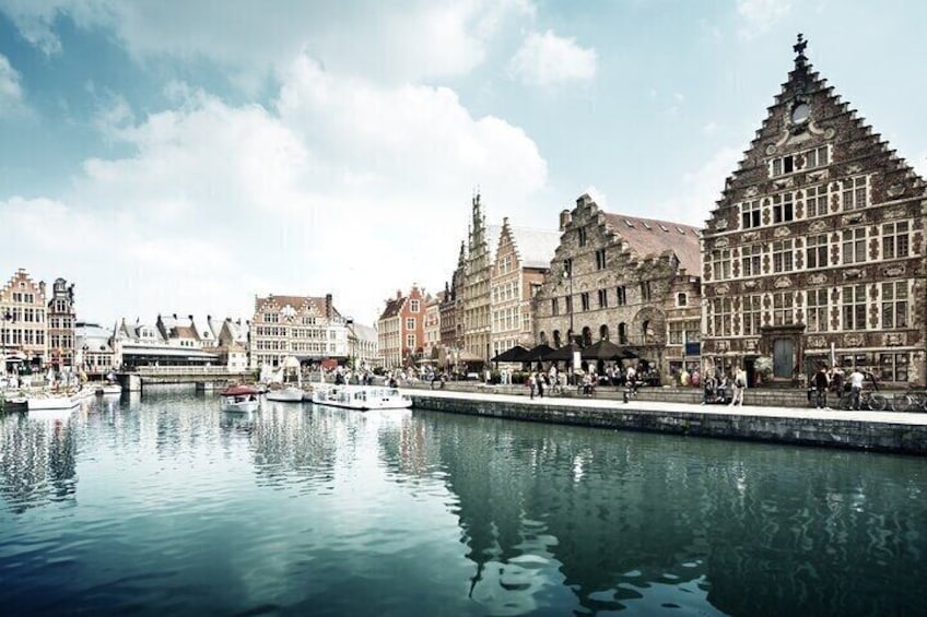 A canal with historic buildings and boats. 5