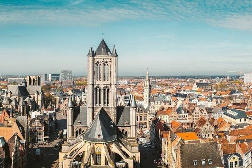 A cityscape with a prominent church featuring a tall tower and a large dome. 3