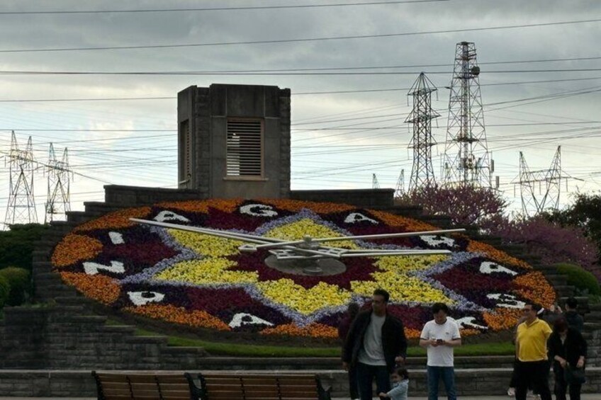 A flower mural with the word 'MAGDALENA' in the center, surrounded by a variety of flowers. 2