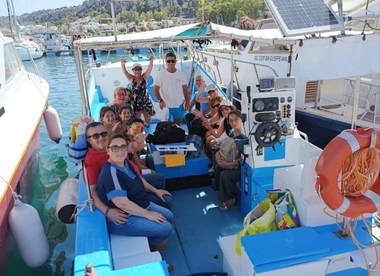 A group of people on a boat with a life buoy and a solar panel. 4