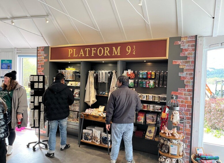 A bookstore with a sign reading 'PLATFORM 9¾' and various books and merchandise on display. 4