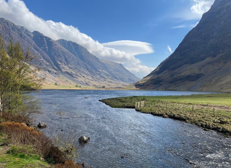 A river flowing through a valley with mountains on either side. 5