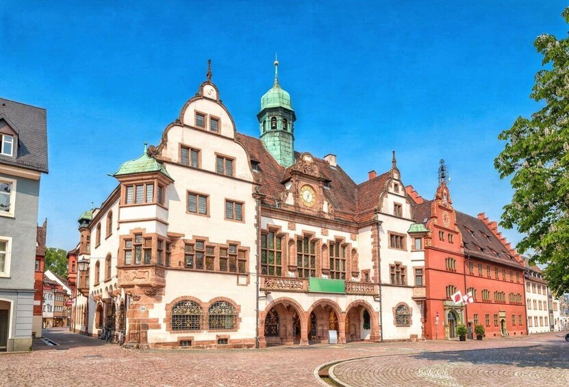 A historic building with a clock tower and arched windows. 5
