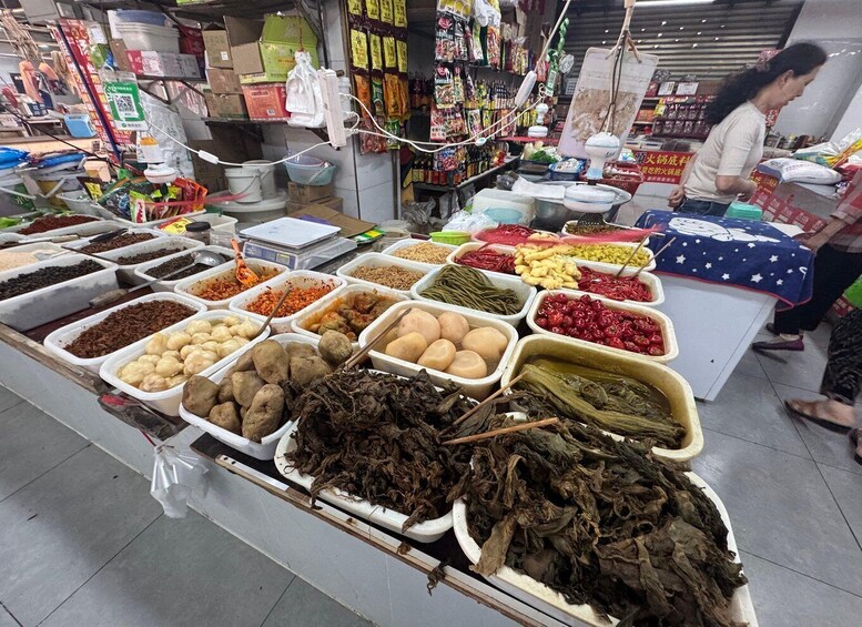 A market stall with various food items and spices. 3