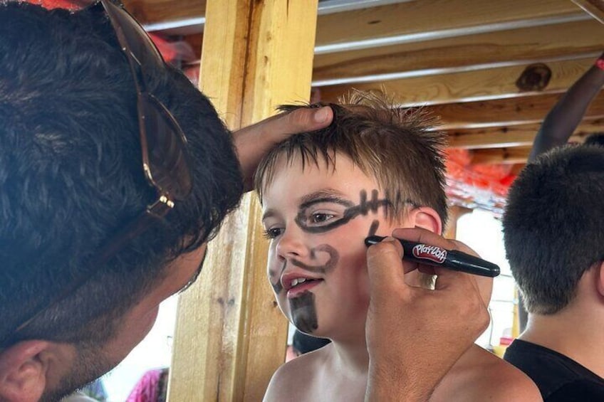 A person applying makeup to another individual. 4