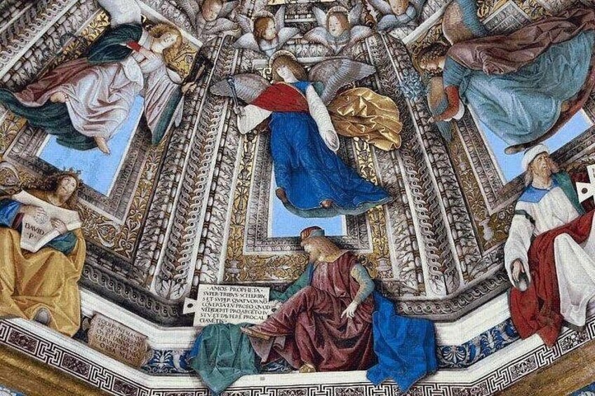 A detailed fresco with figures in various poses, surrounded by ornate architectural elements. 2