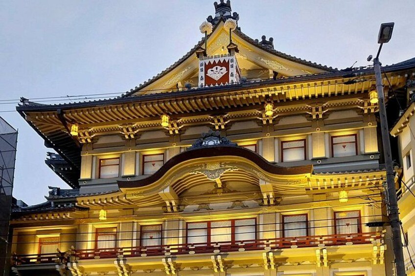 A traditional building with ornate architecture, including a prominent clock and decorative elements. 2