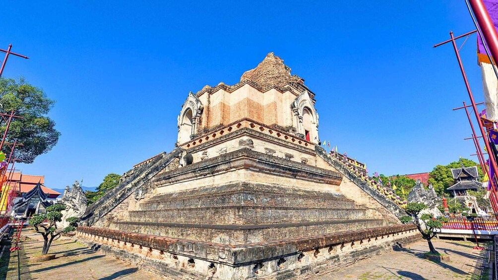 A large, ancient temple with a stepped pyramid structure and a central tower. 3