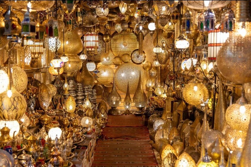 A shop filled with ornate, golden-colored glassware and decorative items. 4