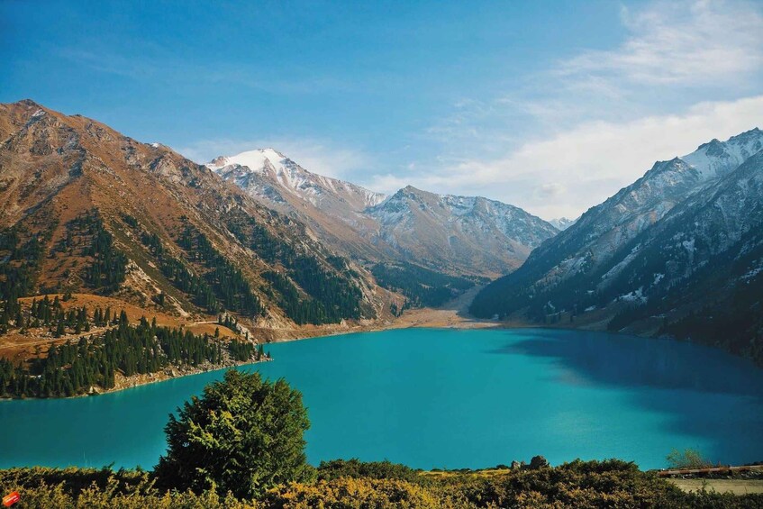 A mountain lake surrounded by rugged mountains. 4