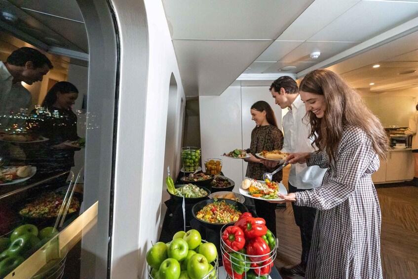 A buffet with various dishes and fruits. 4