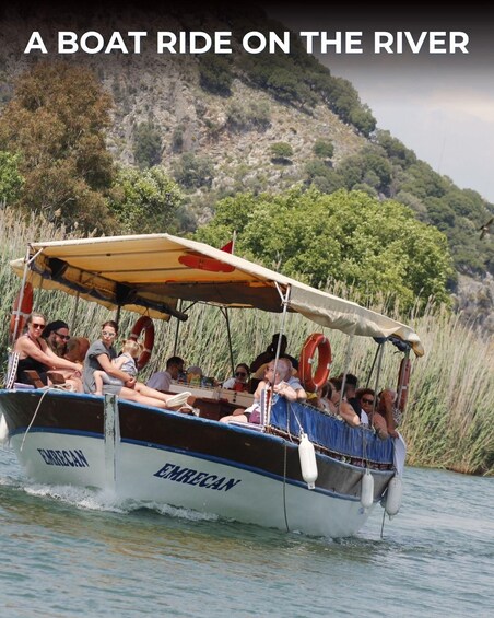 A boat ride on a river with passengers and a mountainous backdrop. 2