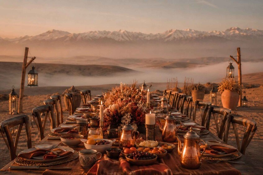 A table set for a meal with a mountainous backdrop. 2