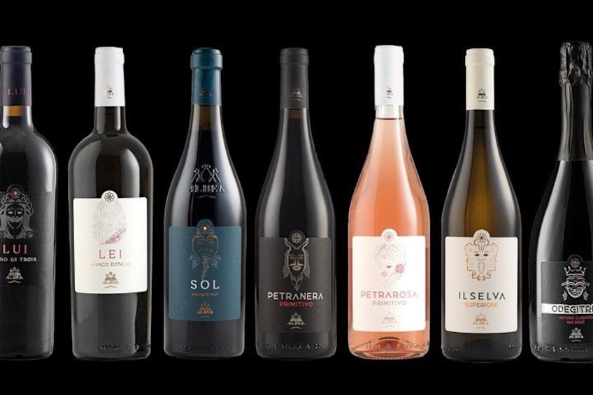 A row of wine bottles with labels. 1