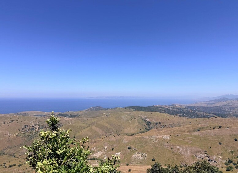 A mountainous landscape with a clear view of the ocean. 3