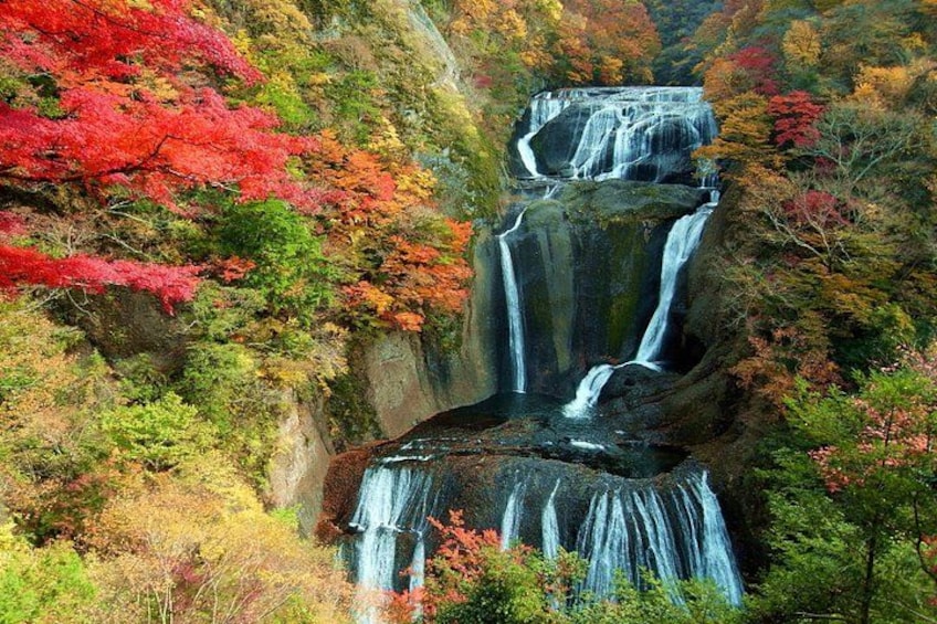 A multi-tiered waterfall surrounded by autumn foliage. 3