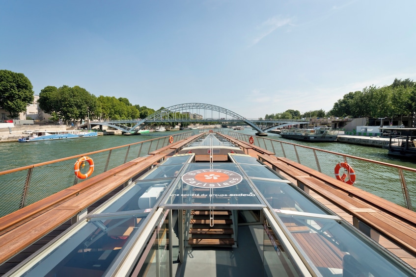 A river with a bridge and boats. 4